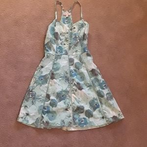 Dress with blue and green flowers on it
